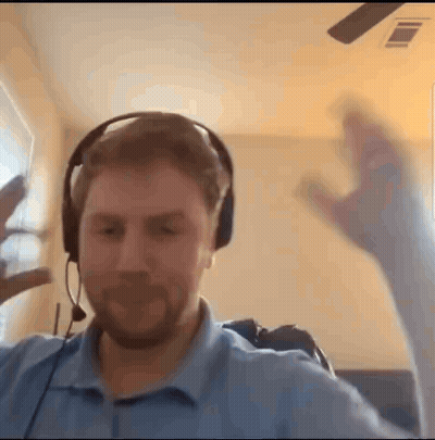 Man With Headphones Making Funny Face At Window GIF