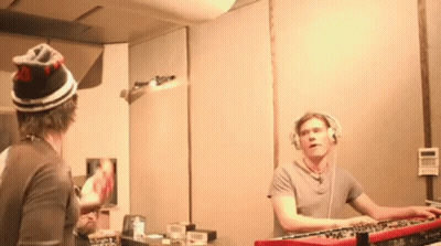 Man With Headphones Playing Keyboard At Mirror GIF