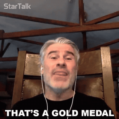 Man With Headphones Saying That's A Gold Medal GIF