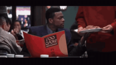 Man With Headphones Says Completely Worthless In Front Of Brick Wall GIF