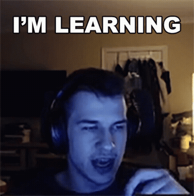 Man With Headphones Says I'm Learning At Computer GIF