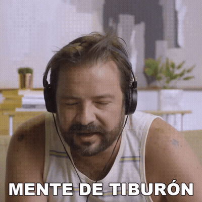 Man With Headphones Says Mente De Tiburon GIF