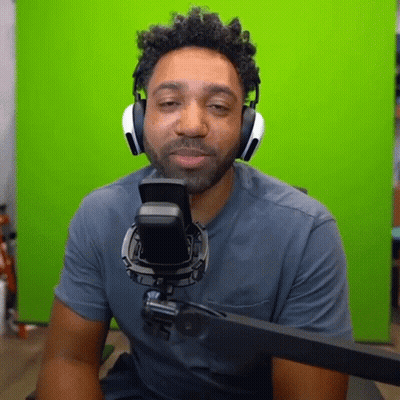 Man With Headphones Sitting At Microphone GIF