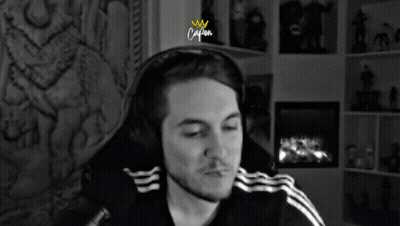 Man With Headphones Sitting By Fireplace Caption GIF