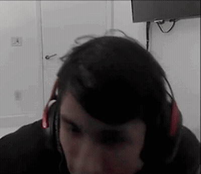 Man With Headphones Sitting In Front Of TV GIF