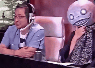 Man With Headphones Sitting Next To Man With Mask GIF