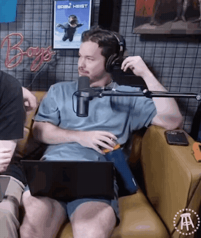 Man With Headphones Sitting On Couch With Laptop GIF