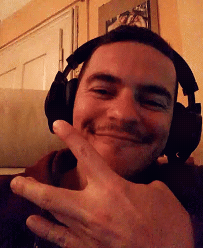 Man With Headphones Smiling And Giving Peace Sign GIF