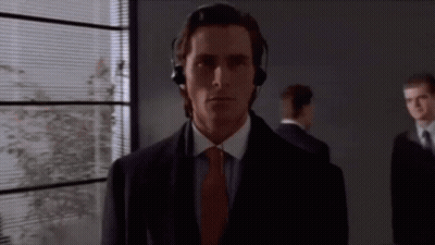 Man With Headphones Standing In Front Of Window GIF