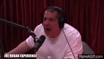 Man With Headphones Talking Into Microphone In Studio GIF