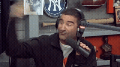Man With Headphones Talking Into Microphone NY Sign GIF