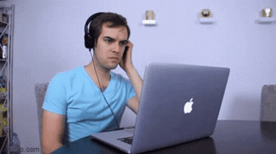 Man With Headphones Using Apple Laptop GIF