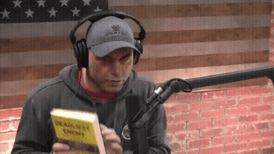 Man With Headphones Vortex Hat Holding Deadliest Enemy Book GIF