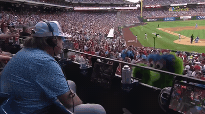 Man With Headphones Watching Baseball Game In Stadium GIF