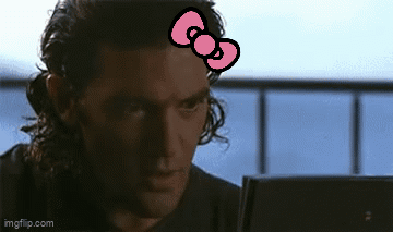 Man With Hello Kitty Bow Looking At Laptop GIF