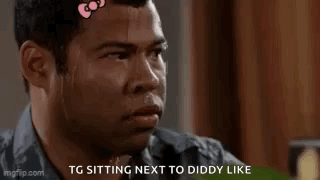 Man With Hello Kitty Bow Sweating Sitting Next To Another Man GIF