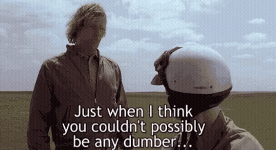 Man With Helmet Standing Next To Another Man In Field GIF