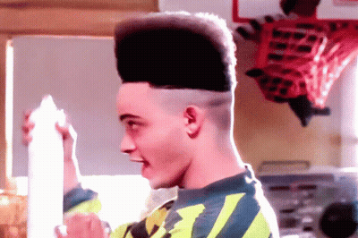 Man With High Top Hairstyle Holding Milk GIF