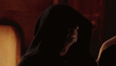 Man With Hood Looking At Something GIF