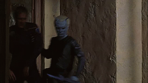 Man With Horns Standing Next To Woman GIF