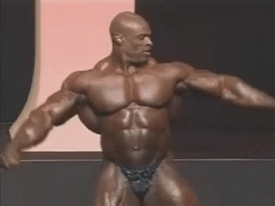 Man With Huge Chest Laughing In Chair GIF