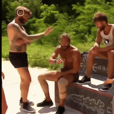 Man With Knee Brace Sitting On Bench GIF
