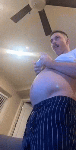 Man With Large Belly Playing Video Game GIF