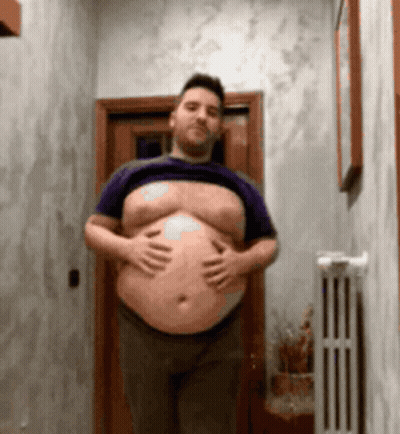 Man With Large Belly Shirtless In Hallway GIF