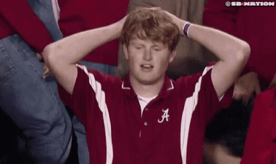 Man With Letter A On Shirt Holding Head GIF