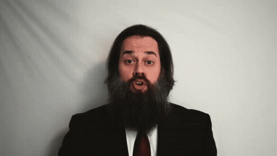 Man With Long Beard In Black Suit And Red Tie GIF