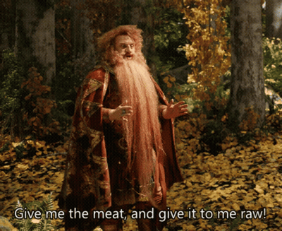 Man With Long Beard In Woods Saying Give Me The Meat And Give It To Me Raw GIF