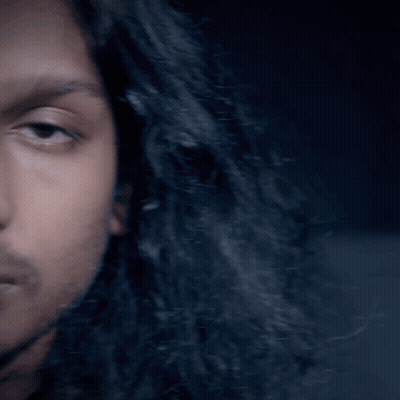 Man With Long Black Hair And Beard Looking At Camera GIF