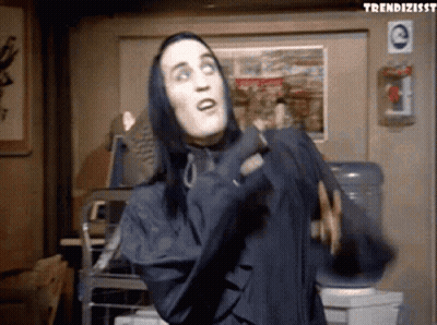 Man With Long Black Hair In Hooded Jacket GIF