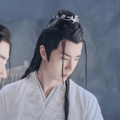 Man With Long Black Hair In White Robe GIF