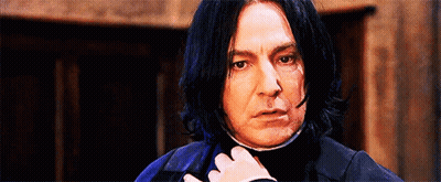 Man With Long Black Hair Looking At Camera GIF