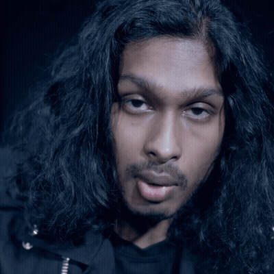 Man With Long Black Hair Making A Face GIF