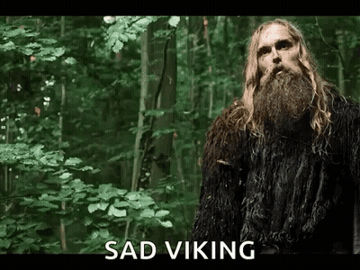 Man With Long Blonde Hair And Beard In Woods GIF