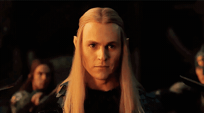 Man With Long Blonde Hair And Ears Looking At Camera GIF