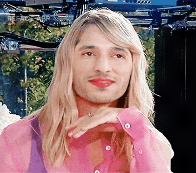 Man With Long Blonde Hair And Red Lipstick GIF