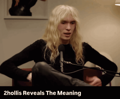 Man With Long Blonde Hair At Microphone 2Hollis Reveals The Meaning Behind Him GIF