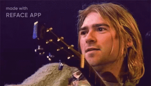 Man With Long Blonde Hair Holding Guitar GIF