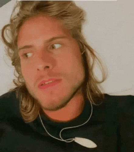 Man With Long Blonde Hair In Black Shirt GIF