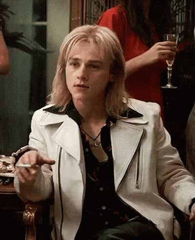 Man With Long Blonde Hair In White Leather Jacket GIF