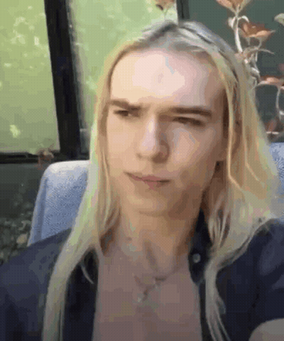 Man With Long Blonde Hair Making Funny Face GIF