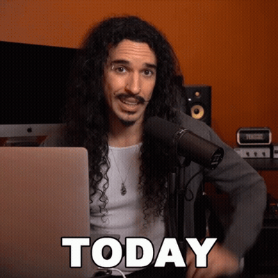 Man With Long Curly Hair At Microphone GIF