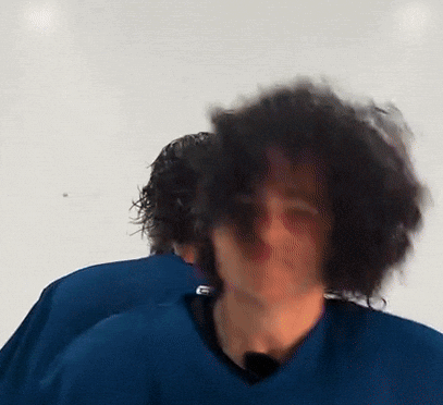 Man With Long Curly Hair In Blue Shirt GIF