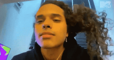 Man With Long Curly Hair Making Funny Face GIF