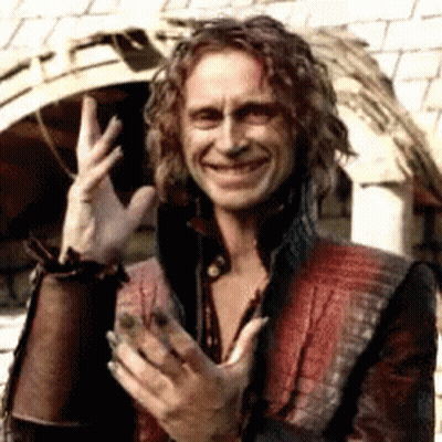 Man With Long Curly Hair Smiling And Waving GIF