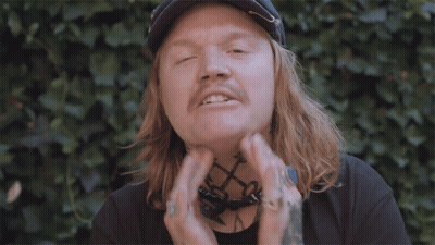 Man With Long Hair And Bandana Giving Peace Sign GIF