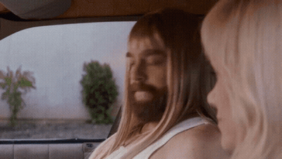 Man With Long Hair And Beard Beside Woman GIF